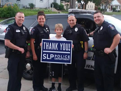 police officers with boy